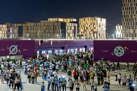 A crowd of fans outside a sports stadium