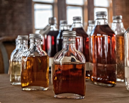 Bottles of Whiskey with different color.