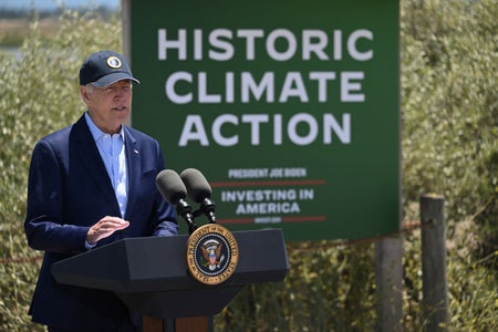 President Joe Biden speaking at a podium.