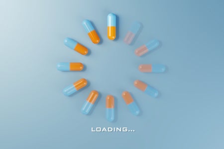 Digital loading symbol with medicine pills, flat lay