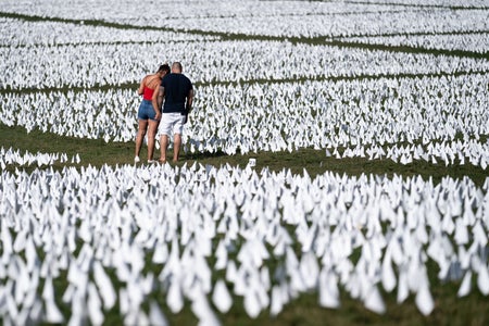 A couple visits the Covid public art memorial on the National Mall in Washington D.C.