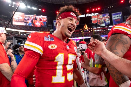 Patrick Mahomes of the Kansas City Chiefs celebrates on football field with teammates