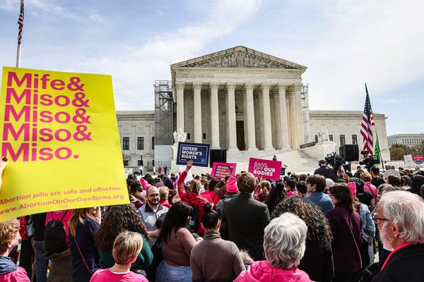 Demonstrators outside the US Supreme Court. Demonstrators are holding signs in support of legalized abortion and abortion pills